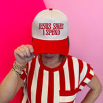 Red two-tone Jesus Saves I Spend cotton cap with adjustable strap and embroidered lettering.