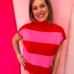 Red and pink striped mock neck sweater with scalloped hem.