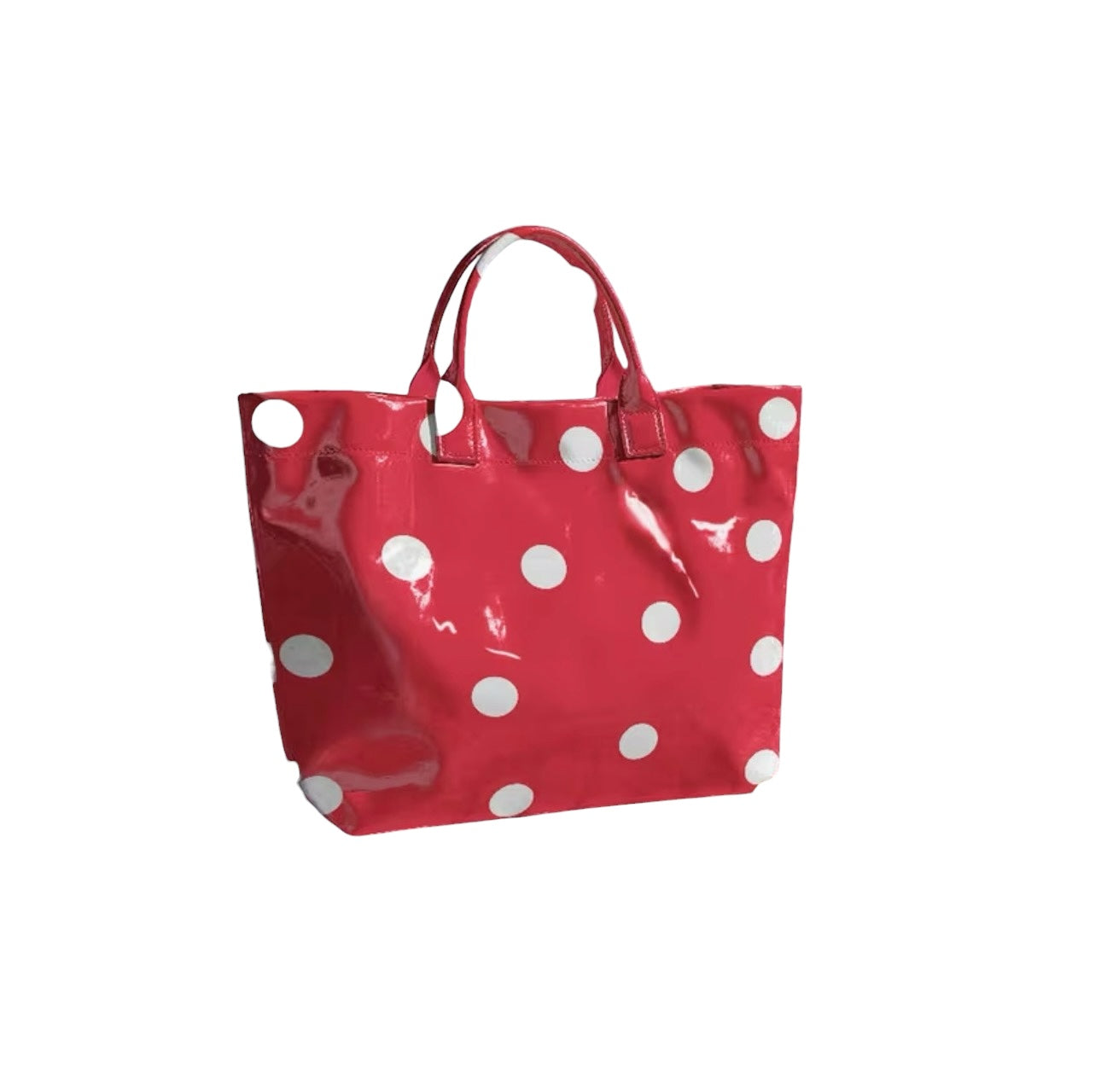 Red tote bag with oversized white polka dots and sturdy top handles.
