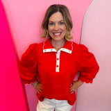 Red puff sleeve top with scalloped trim and contrast neckline