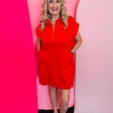 Ruby red textured jacquard mini dress with quarter zipper neckline, side pockets, and high-low hem.