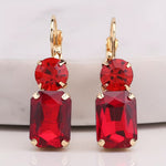 Oversized red rectangle rhinestone earrings with round rhinestone top and fish hook dangle.