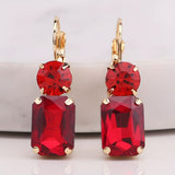 Oversized red rectangle rhinestone earrings with round rhinestone top and fish hook dangle.