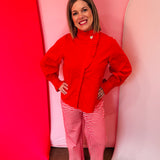 Red cotton blouse with ruffle mock neck and balloon sleeves.