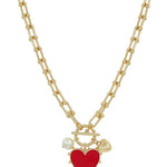 Gold chain necklace with red studded heart charm featuring adjustable 16 to 18 inch length.
