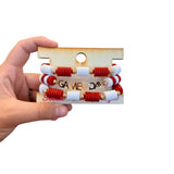 Red and white Game Day bracelet stack with gold charm accents.
