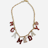 Red and white game day necklace with gold-tone chain, letter, bow, and checkered heart charms.