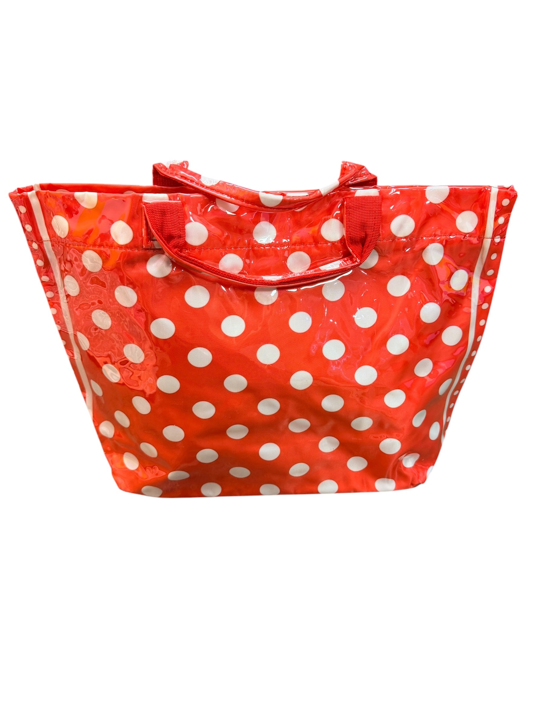 Red PVC tote bag with white polka dots, sturdy top handles, interior pockets, and Velcro closure.