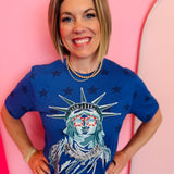 Blue Lady Liberty graphic tee with rhinestone star sunglasses and collared neckline