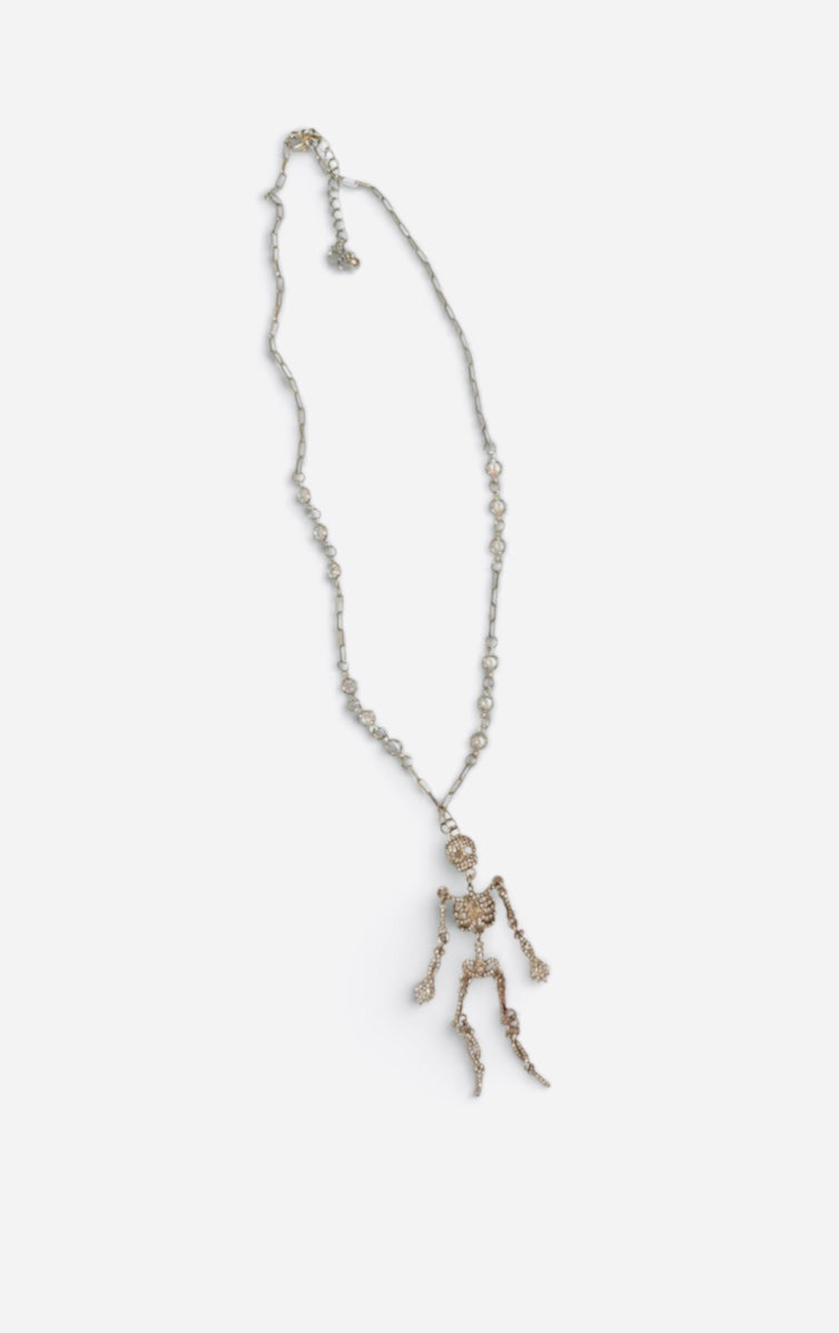 Rhinestone skeleton necklace with dangling crystal-covered skeleton pendant.