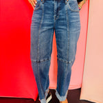 Medium wash cropped wide leg jeans with seam detail and cuffed hem.