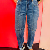 Medium wash cropped wide leg jeans with seam detail and cuffed hem.