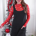 Black ribbed jumper dress with front pockets, perfect for layering and everyday style.