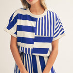 Royal blue and white striped colorblock top with mixed stripe panels and relaxed drop shoulder fit