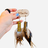 Feather earrings with ruler metal accents and rhinestone details western style