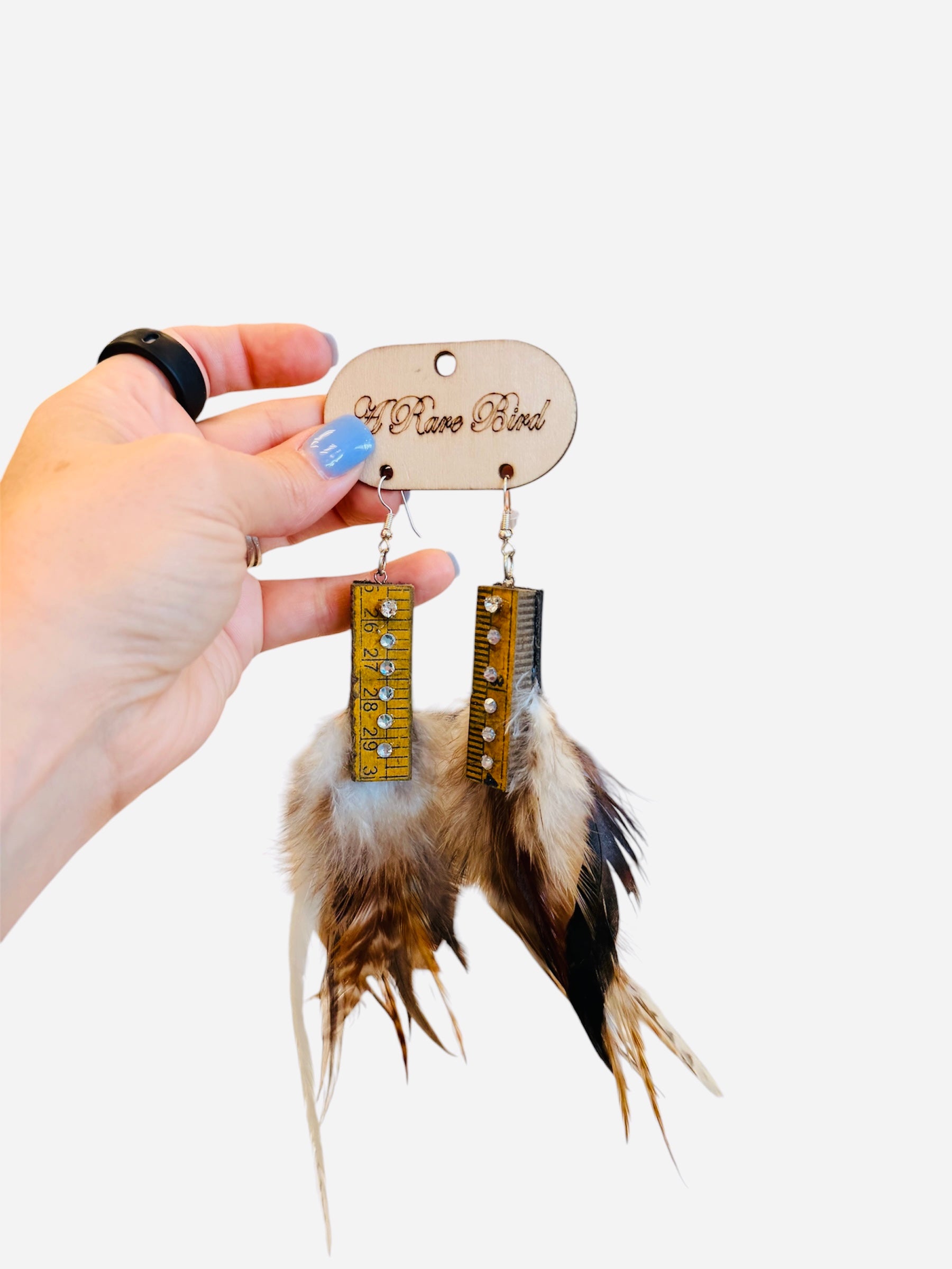 Feather earrings with ruler metal accents and rhinestone details western style