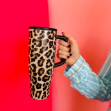 40oz leopard print tumbler with flip-straw, handle, screw-on lid, and car cup holder compatibility.