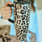 40oz leopard print tumbler with flip-straw, handle, screw-on lid, and car cup holder compatibility.