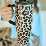 40oz leopard print tumbler with flip-straw, handle, screw-on lid, and car cup holder compatibility.