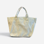 Sage green pinstripe PVC tote bag with glossy finish and double handles.