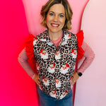Festive leopard-print puffer vest with santa accents, perfect for layering and staying warm.