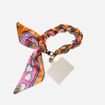 Silky scarf phone holder wristlet with gold chain and pastel peach pink blue colors