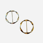 Versatile scarf slide ring used to style scarves or gather t-shirts and tops.