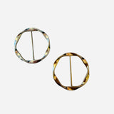 Versatile scarf slide ring used to style scarves or gather t-shirts and tops.