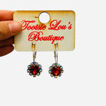 Silver hoop earrings with red gemstone drop and rhinestone halo