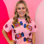 Light pink top with double bubble graphic and pink sequin star accents.
