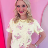 Butter yellow top with pink sequin crabs and pink rhinestone accents.
