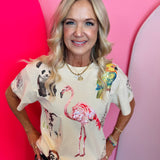 White top with colorful sequin safari animals including giraffe zebra flamingo and panda.
