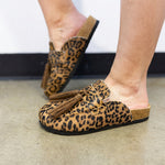 ShuShop Ariana leopard print hair-on leather mules with black fringe and buckle detail.