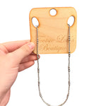 Delicate silver beaded necklace with evenly spaced larger beads and water-resistant design.