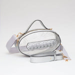 Clear football crossbody bag with metallic silver trim, gold hardware, top handle, and adjustable strap.
