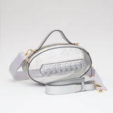 Clear football crossbody bag with metallic silver trim, gold hardware, top handle, and adjustable strap.