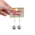 Silver Orbit Drop Earrings – silver-tone open teardrop with polished silver sphere, lightweight modern design