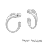 Silver textured volumed hoop earrings with modern design, lightweight feel, and subtle everyday shine.