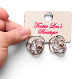 Silver wire rose stud earrings with looping petals and polished silver bead centers.