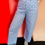 Sky blue barrel pants with white polka dots and a high-waist fit.