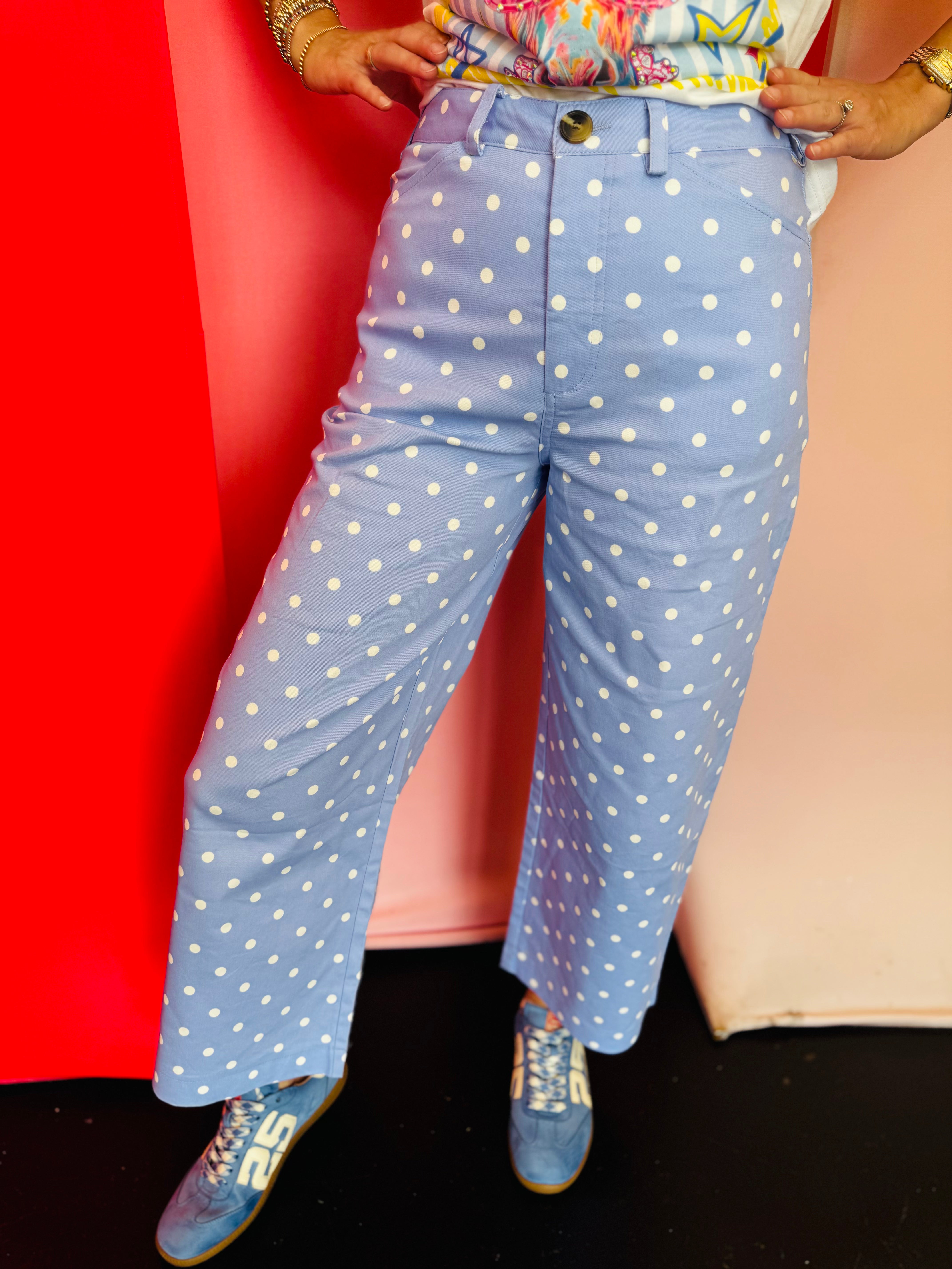 Sky blue barrel pants with white polka dots and a high-waist fit.