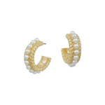 Small gold textured hoop earrings with delicate pearl accents.