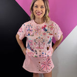 Pink top and skort set with colorful sequin amusement park graphics and gold lettering.