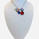 Silver necklace with red blue and clear crystal charm cluster