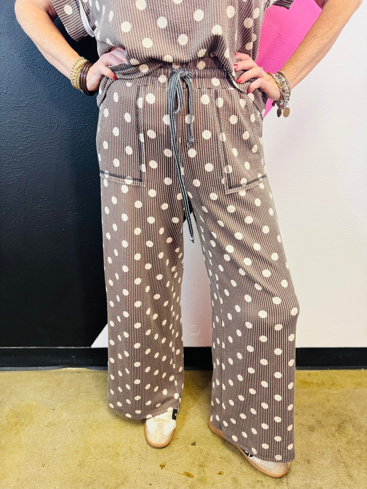 Mocha ribbed wide-leg pants with cream polka dots, drawstring waist, and front patch pockets.
