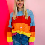 Oversized striped crochet sweater with distressed edges, relaxed boho style layering top.