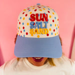 White polka dot hat with blue bill and colorful Sun Salt Sand embroidery.