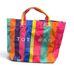 Colorful striped tote bag with glossy water-resistant finish.