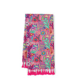 Floral cotton tea towel with vibrant blooms on a hot pink background.