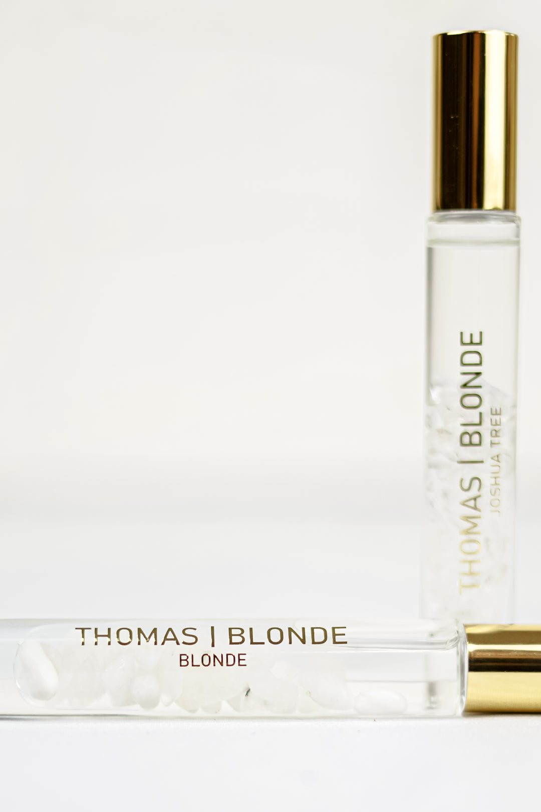 Thomas Blonde - 10mL roll-on perfume bottle with a clear cap, showing moonstone crystals inside.